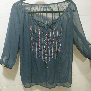 Blue blouse with design on front and back